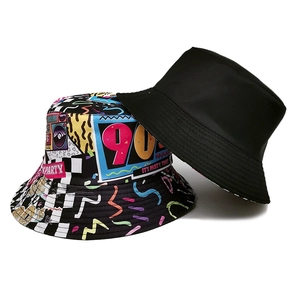 Retro 90s reversible bucket hat with hip hop graffiti print and solid black canvas design