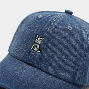 Close-up of the vintage blue denim baseball cap featuring detailed small cat embroidery