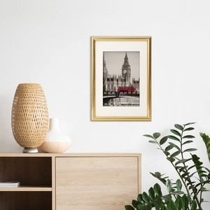 Golden PVC frame with London photography display hanging on wall in modern home setting