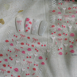5D embossed nail art stickers with red lips, bows and hearts on almond nails