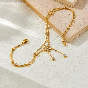 Gold double-layer stainless steel anklet with cubic zirconia flower and tassel chain