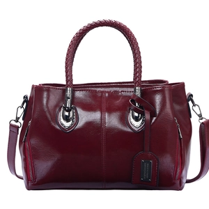 Vintage burgundy Boston handbag with woven handles and polished finish for women