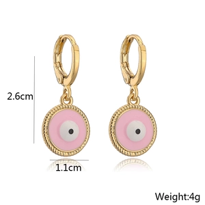 Detail shot of pink enamel evil eye gold earrings with 2.6cm length and 4g weight