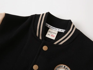 Detail of boys' varsity jacket ribbed collar and woven size tag in 90/52 measurement