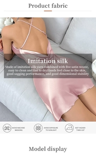 Detail of cross-back straps on a pink imitation silk slip dress with satin texture