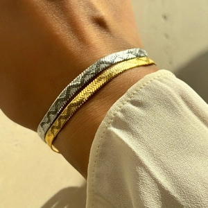 Minimalist 4mm herringbone snake chain bracelet set in 18k gold and silver finishes