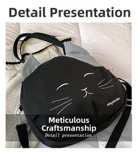 Detail of cute black cat head shaped canvas bag with gray ears and whiskers print