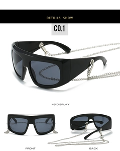 Detail view of large Y2K fashion sunglasses with a removable silver metal hanging chain