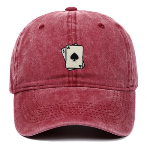Detailed embroidery of Ace and Jack playing cards on washed red cotton baseball cap
