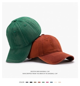 Detail of distressed washed denim baseball caps with frayed edges and vintage textures