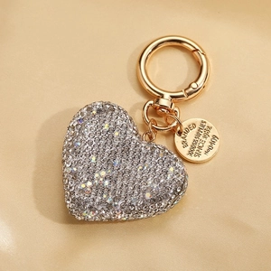 Sparkling silver rhinestone heart keychain with gold clasp and vintage metal tag