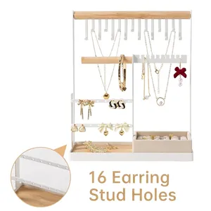 White iron jewelry organizer stand with wooden bars and a 16-hole earring display