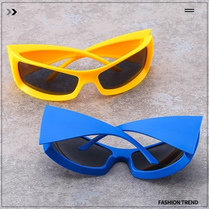 Detail view of futuristic Y2K wrap-around sunglasses in vibrant yellow and blue colors