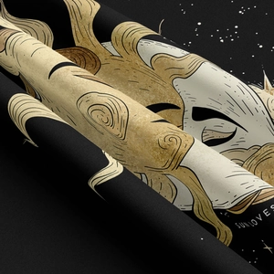 Macro view of Sun Loves black and gold celestial tapestry fabric with starry print