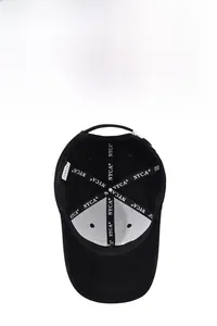 Close-up of internal black baseball cap seams featuring NYCA branded woven tape
