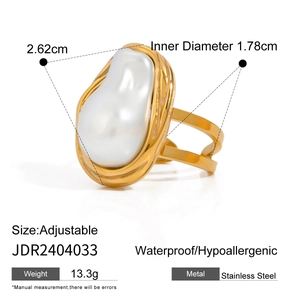 18k gold plated stainless steel open ring featuring a baroque pearl on a white background