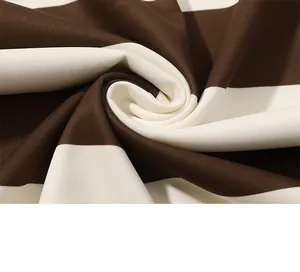 Detail of brown and white striped knit fabric showing soft texture and premium stitching