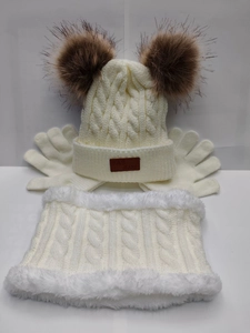 Detail of the cozy cream knit set featuring a fleece-lined neck warmer and cable texture
