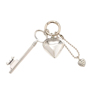 Sleek silver metal heart keychain set featuring a vintage key and engraved pendant