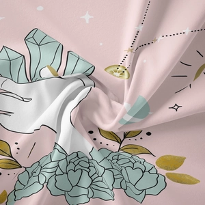 Close-up detail of soft pink bohemian tapestry fabric with floral and crystal patterns