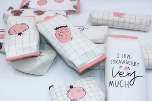Detail view of large capacity PU pencil cases with strawberry and pomegranate patterns