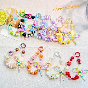 Detailed view of colorful Y2K beaded phone straps with resin charms and letter beads