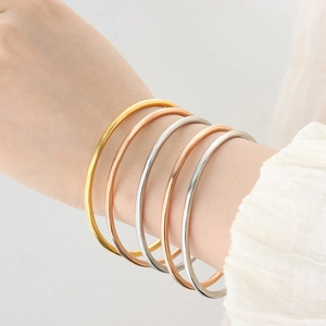 Set of five minimalist titanium steel thin bangles in gold, rose gold and silver