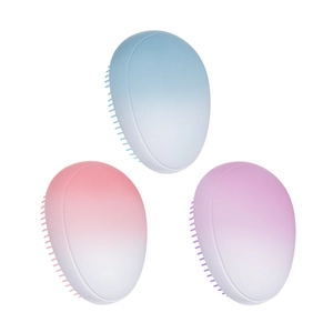 Three gradient portable egg-shaped hairbrushes in blue, pink, and purple on white background