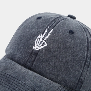 Vintage washed baseball cap with white skeleton peace hand embroidery on front