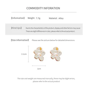 Macro view of minimalist irregular flower earrings showing alloy material details and dimensions