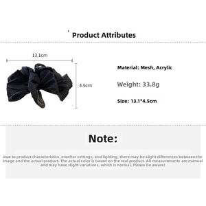 Detail view of black mesh bow hair claw clip with size dimensions 13.1cm and 4.5cm