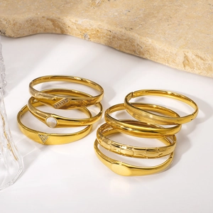 Classic 18K gold-plated titanium steel bangles with shell inlay and sparkling crystals