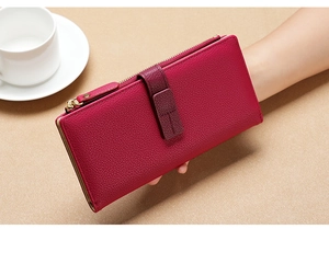 Detailed view of the red long leather wallet featuring a metal zipper and secure clasp