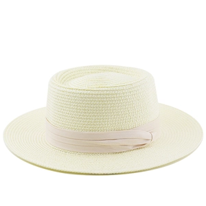 Detail of beige straw boater hat with a light pink ribbon and fine woven texture