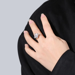 S925 sterling silver ring featuring a pear-cut zircon shown on a finger for scale