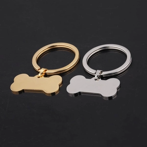 Polished bone-shaped stainless steel pet tags in gold and silver finishes