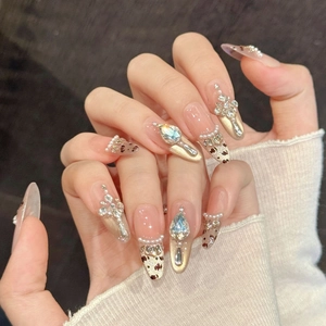 Pink leopard print press-on nails with luxury pearls, sparkling rhinestones, and almond shape