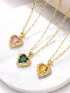 Detailed top view of gold heart necklaces with pink green and yellow zircon stones