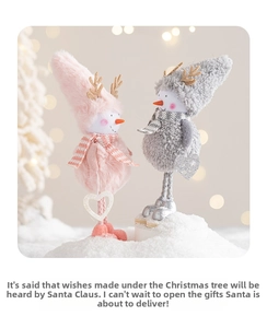 Detail of plush snowman reindeer figurines with heart pendants in Christmas scene