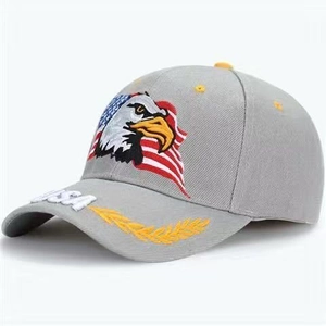 Detailed close-up of American flag eagle embroidery and USA laurel leaf on grey cap