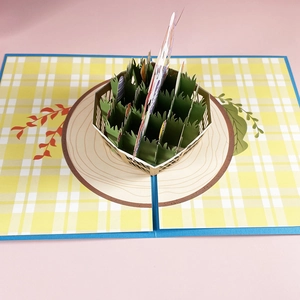 3D pop-up Easter greeting card featuring a rabbit flower basket and yellow checkered interior