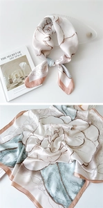 Detail of silk satin square scarf with floral print and soft morandi color blocks