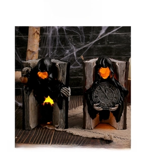 Gothic ghost book figurines with glowing lanterns and skull details for spooky decor
