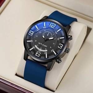 Detail view of quartz watch with blue silicone strap on a cream display cushion