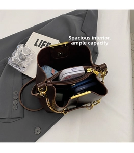 Top view of brown leather bucket bag showing large capacity interior with daily items