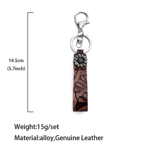 Vintage western leather keychain with sunflower metal accent and floral embossing