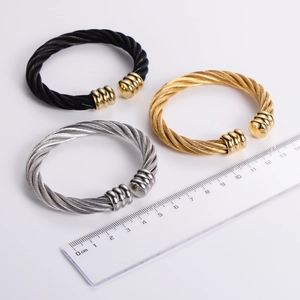 Three-color twisted cable cuff bracelets in black gold and silver with steel wire texture