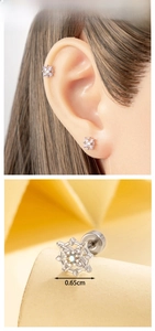 Detail view of 0.65cm star ear stud with blue gemstone and micro-set zirconia inlay