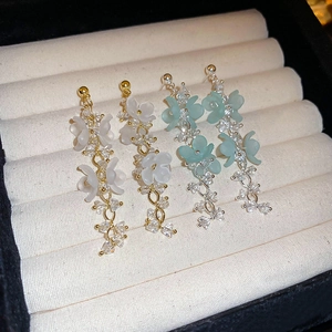 Elegant resin flower earrings with crystal tassels in cream and pale green styles