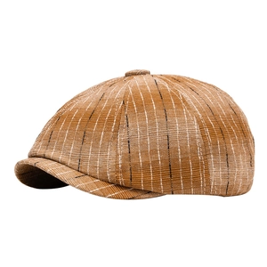 Classic brown checkered newsboy cap in British style with octagonal shape and retro pattern